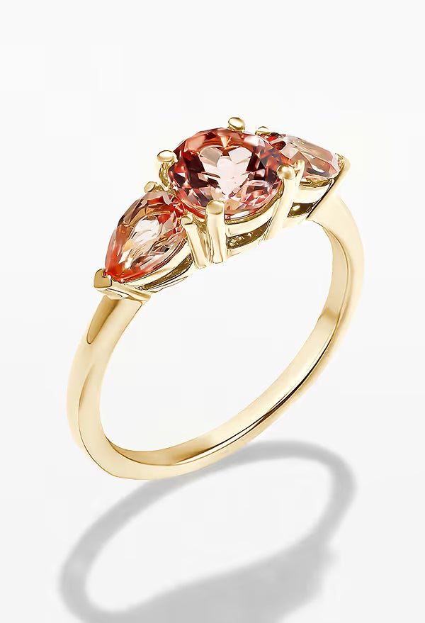 A three stone ring set with grown gemstones