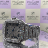 side front view of fully iced out silver luxury watch from pragalbh jewels featuring blue hands and roman numerals